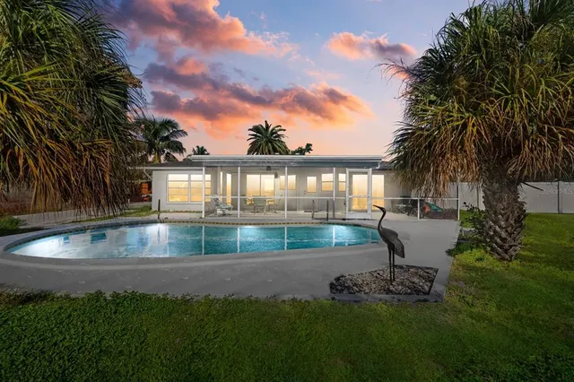 view of a lake with a house in the background