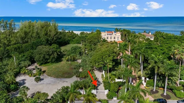 an aerial view of a house with a lake view