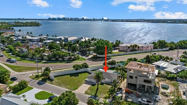 an aerial view of a house with a lake view