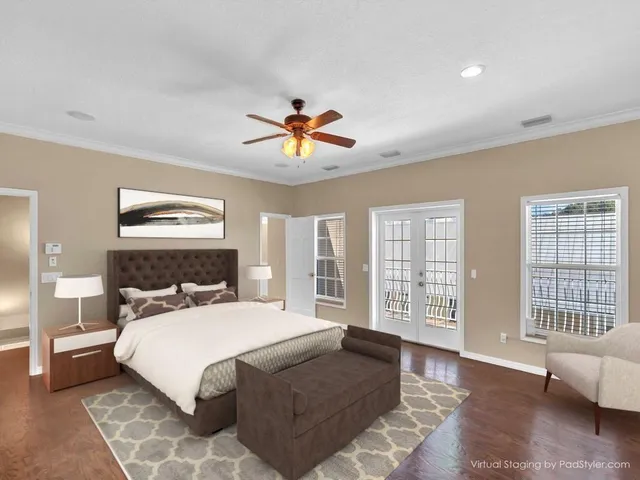 a bedroom with a large bed and a window