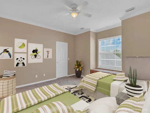 a bedroom with a bed and ceiling fan