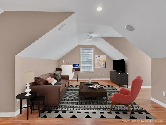 a living room with furniture or couch and a flat screen tv