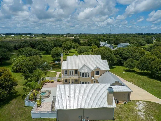 an aerial view of a house with a garden