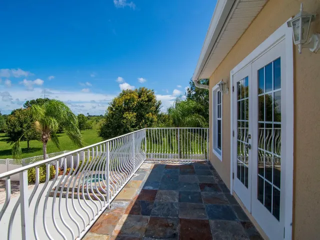 a view of balcony with yard