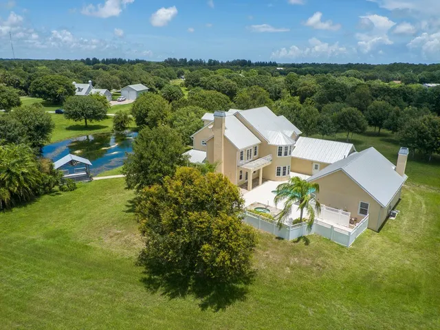 an aerial view of a house with a garden