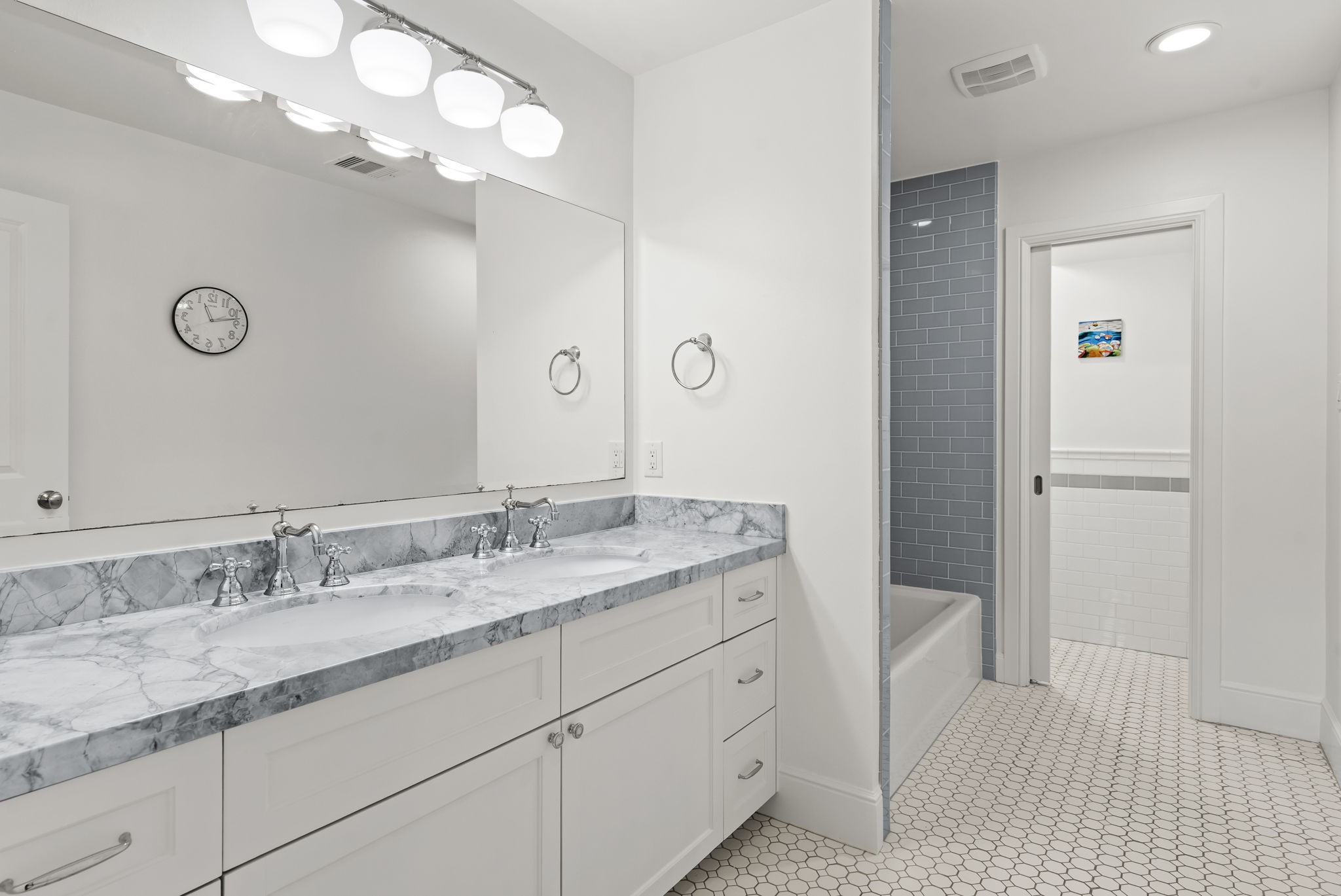 13614 Apple Tree Road Houston, TX 77079 - Photo 28 of 38 a bathroom with a granite countertop sink a light fixture and a mirror