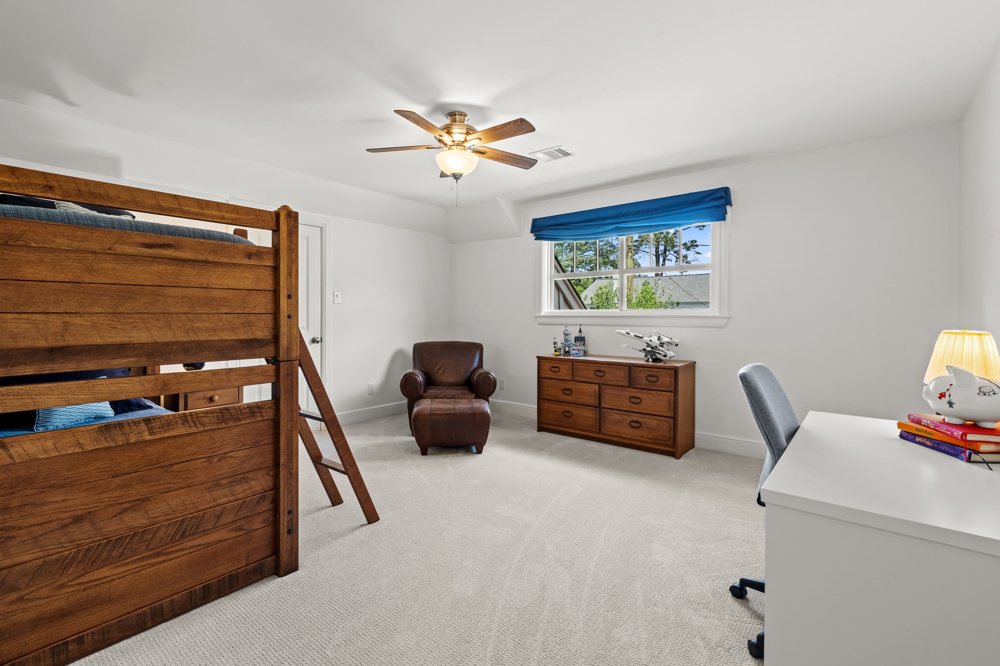 13614 Apple Tree Road Houston, TX 77079 - Photo 29 of 38 a living room with furniture and a flat screen tv