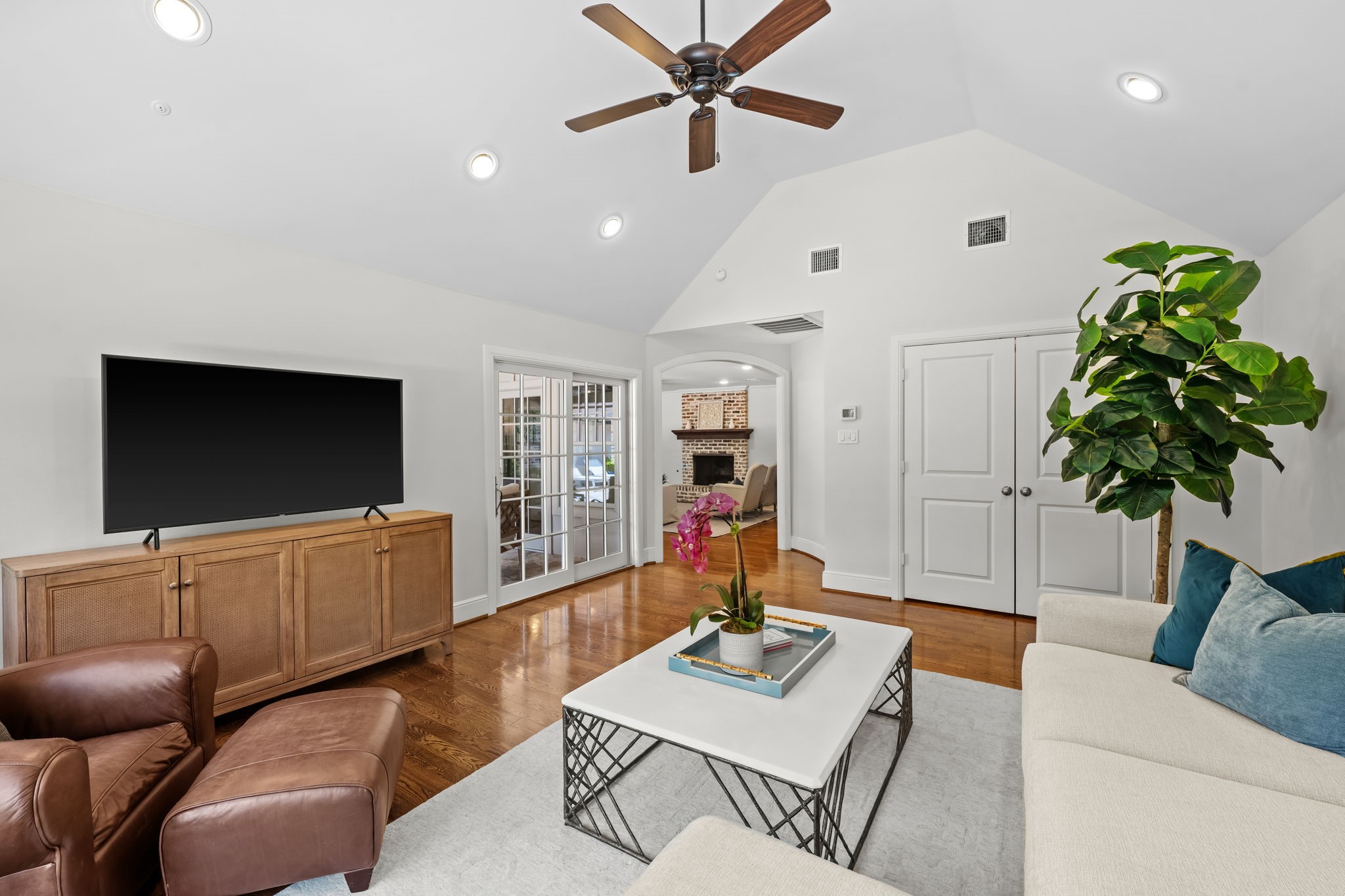 13614 Apple Tree Road Houston, TX 77079 - Photo 8 of 38 a living room with furniture and a flat screen tv