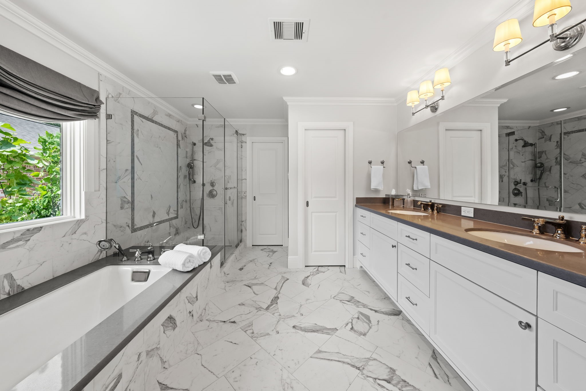 13614 Apple Tree Road Houston, TX 77079 - Photo 10 of 38 a spacious bathroom with a double vanity sink mirror and shower