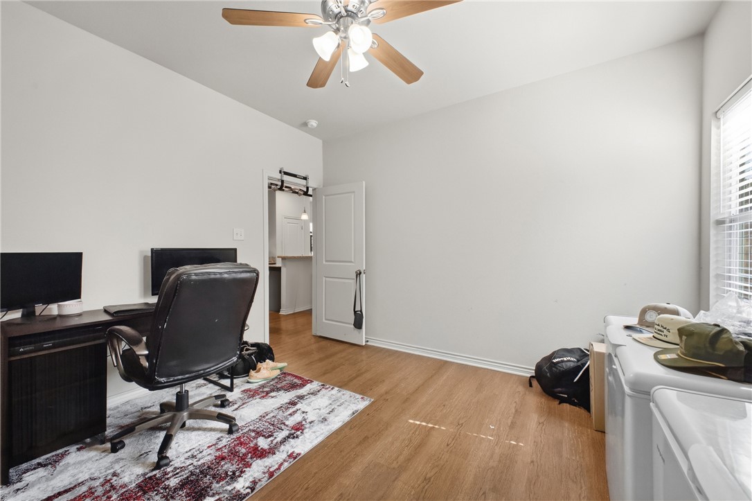 4400 Milam Street Bryan, TX 77801 - Photo 9 of 25 a view of workspace with wooden floor windows