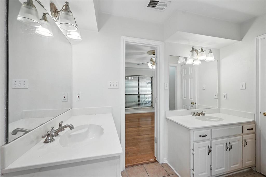 1928 Meandering Way McKinney, TX 75071 - Photo 14 of 22 a bathroom with a sink double vanity and a mirror