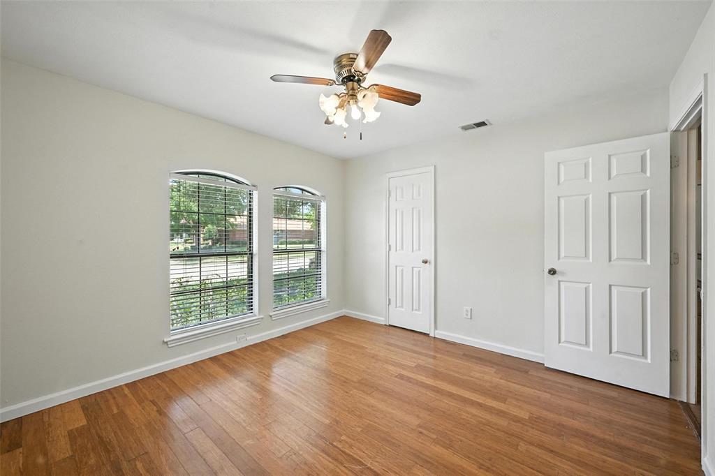 1928 Meandering Way McKinney, TX 75071 - Photo 15 of 22 a view of an empty room with wooden floor and a window