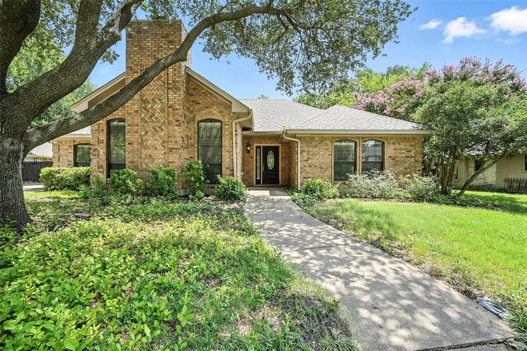 1928 Meandering Way McKinney, TX 75071 - Photo 2 of 22 a front view of house with yard and green space