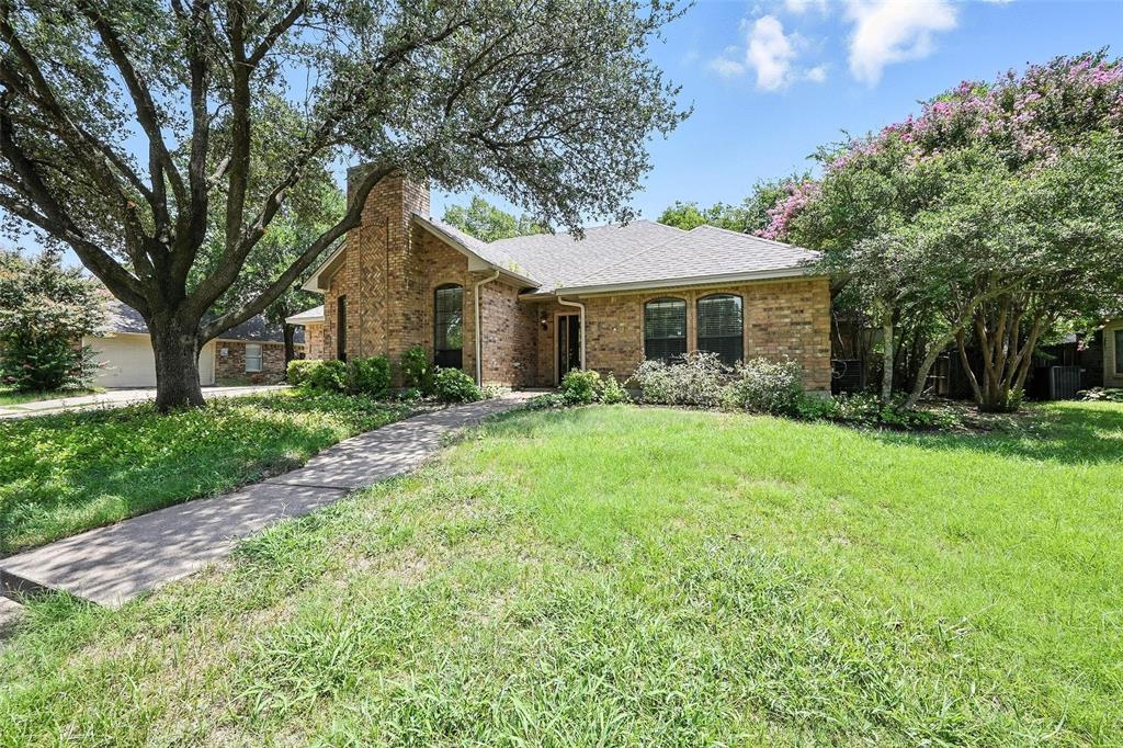 1928 Meandering Way McKinney, TX 75071 - Photo 20 of 22 a front view of house with yard and green space