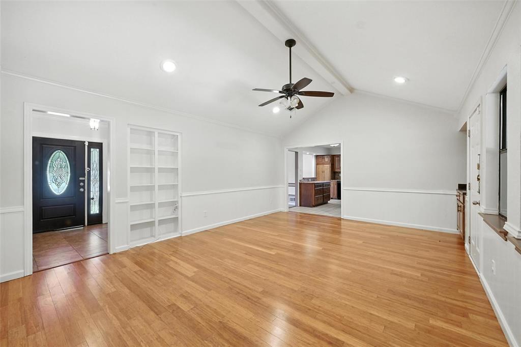 1928 Meandering Way McKinney, TX 75071 - Photo 8 of 22 a view of an empty room with a window and wooden floor