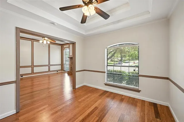 wooden floor in an empty room with a window