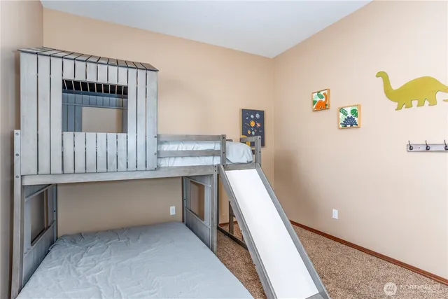 a kitchen with a refrigerator and a stove