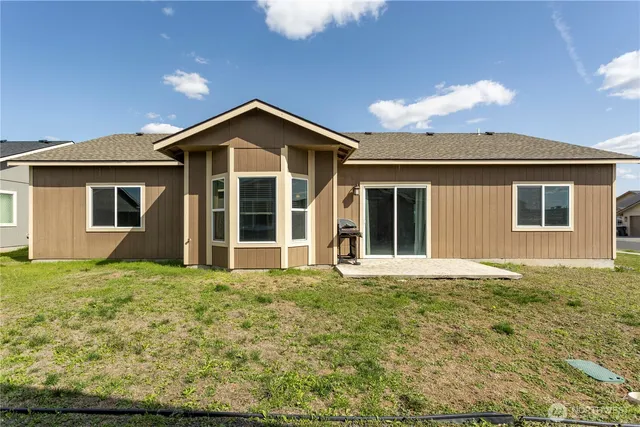 a front view of a house with yard