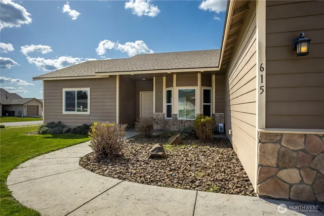 a front view of a house with garden