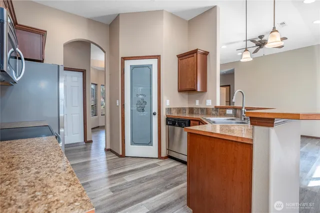 a spacious bathroom with a sink and a mirror