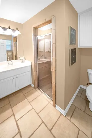 a large bathroom with a tub and shower