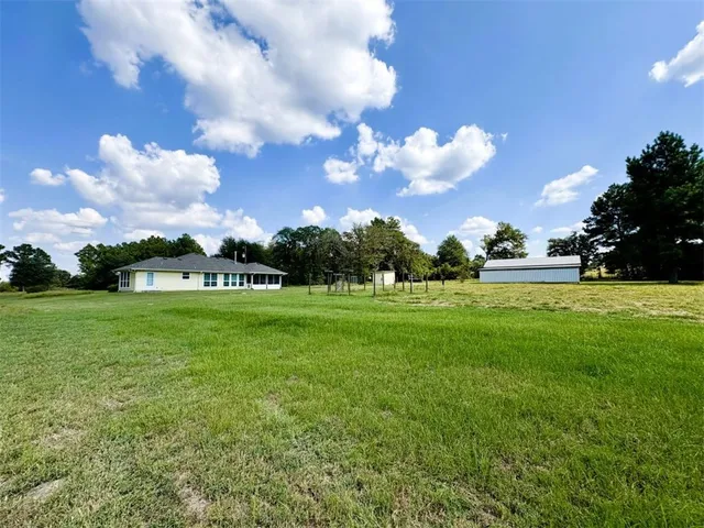 a view of a house with a big yard