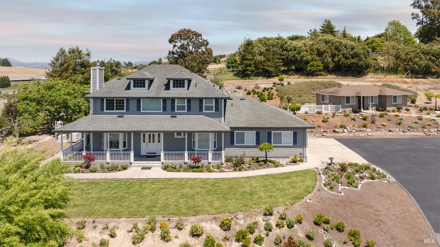 4059 Canfield Road Sebastopol, CA 95472 - Photo 1 of 1 a front view of a house with swimming pool having outdoor seating