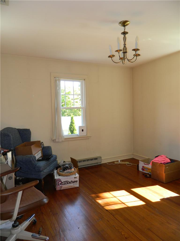 2130 Huntington Street Bethlehem, PA 18017 - Photo 19 of 23 Hardwood floors and a classic chandelier illuminate this flexible room, ideal for an office or quiet retreat.