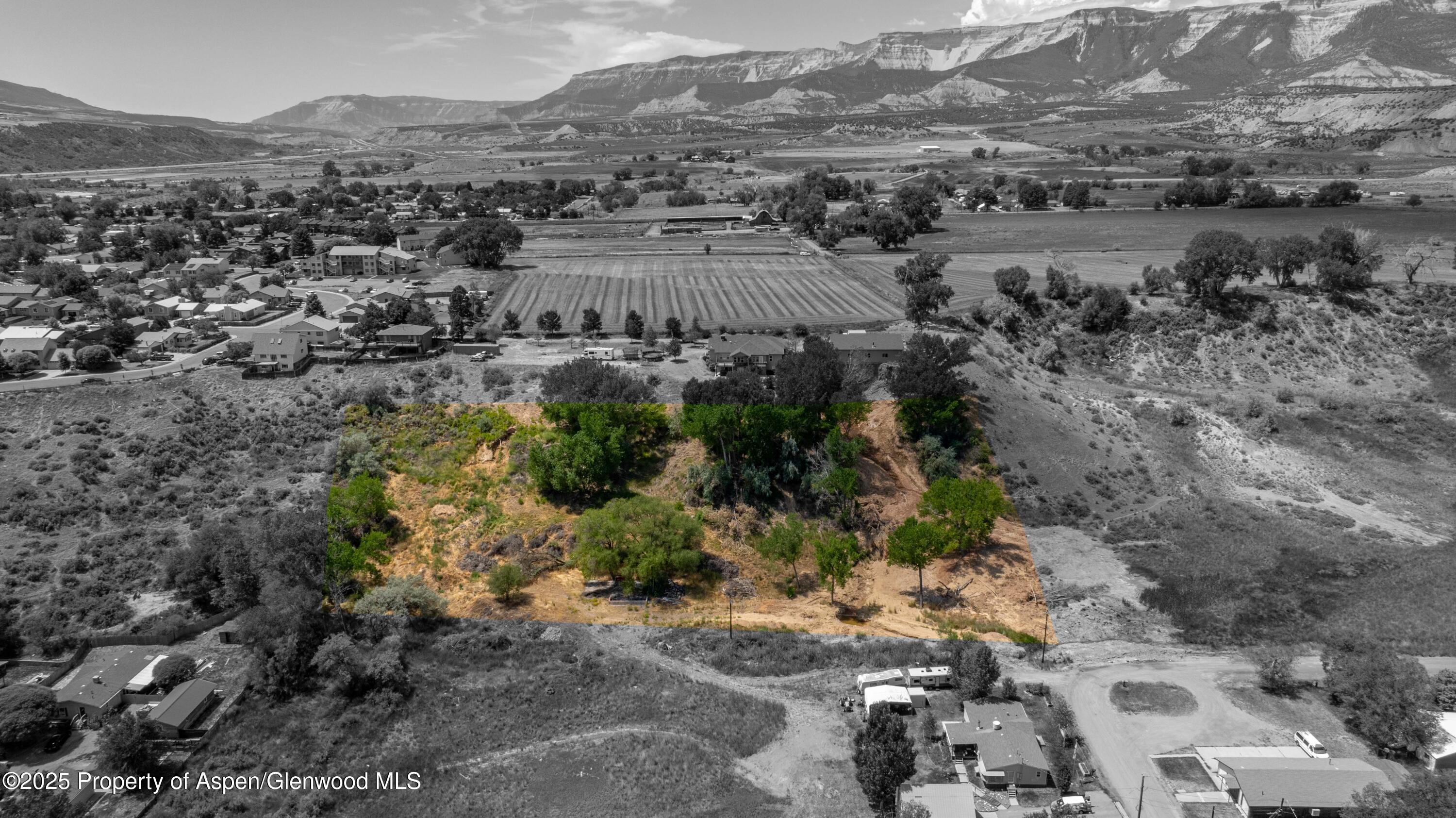 a view of a town with mountains in the background