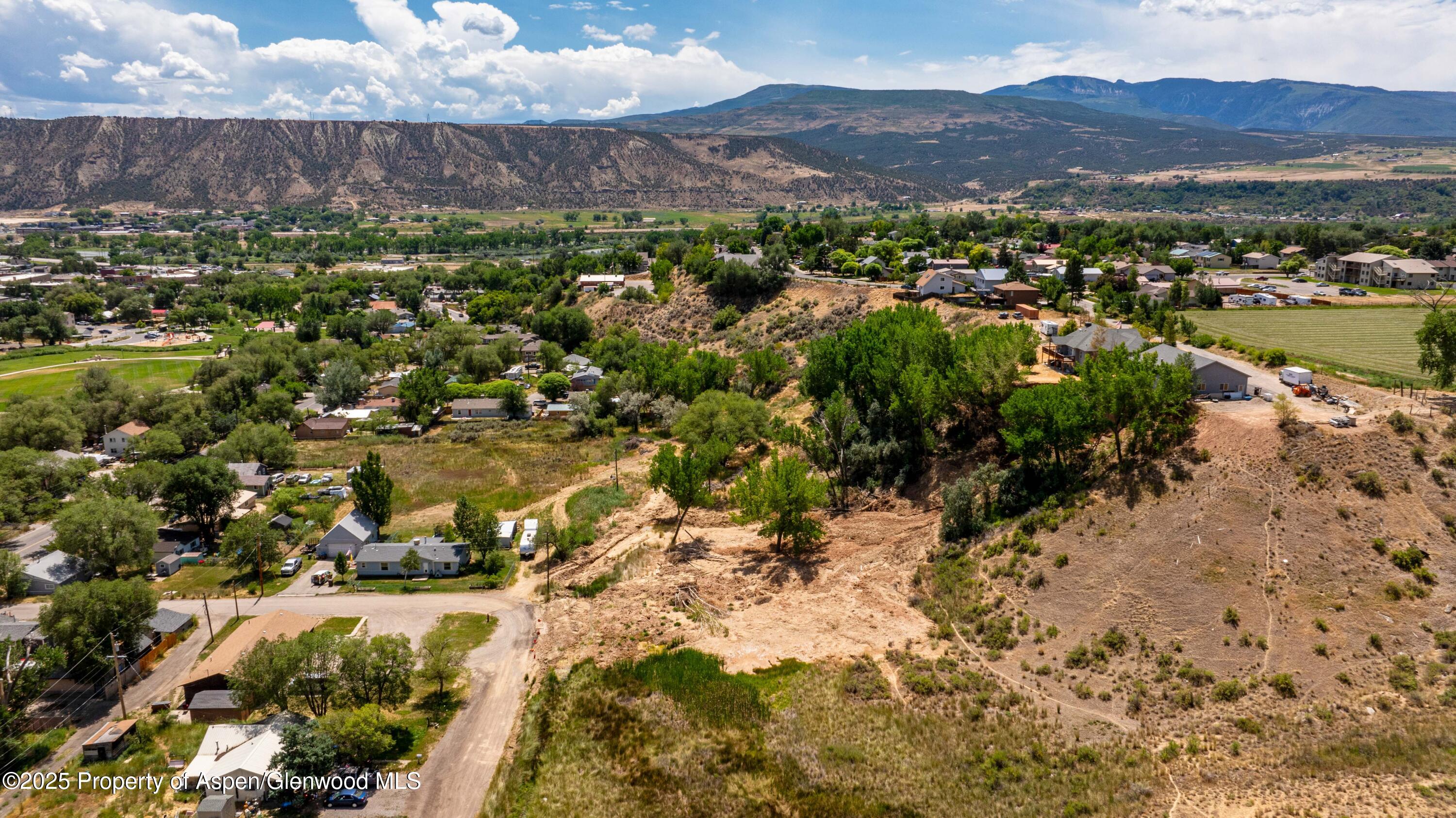 Tbd Stillwell Avenue Rifle, CO 81650 - Photo 10 of 14 a view of a city with mountains in the background