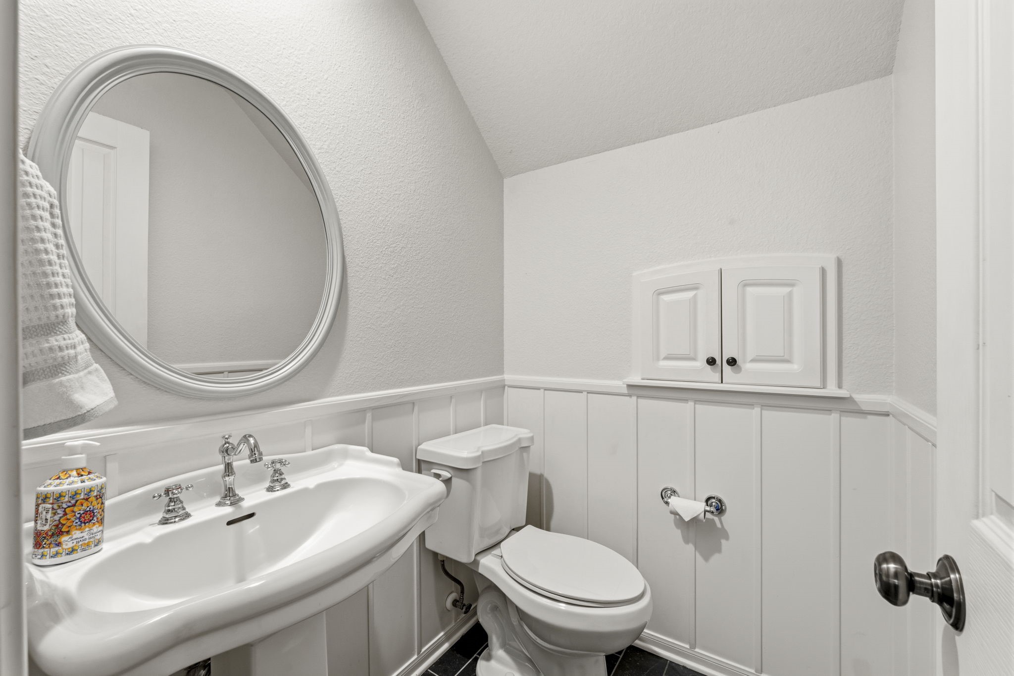 6 North Flickering Sun Circle Spring, TX 77382 - Photo 24 of 33 Secondary bathroom with pedestal sink. Beautiful wainscoting surrounds the room!