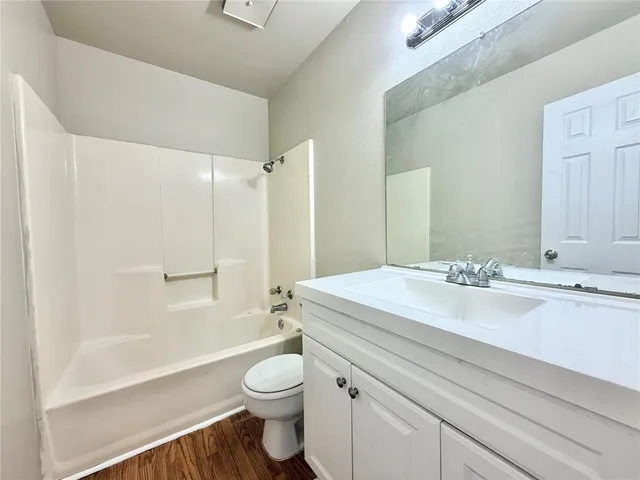 a bathroom with a sink a toilet and a bathtub