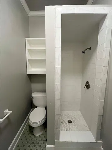 a utility room with a washer dryer and a shower