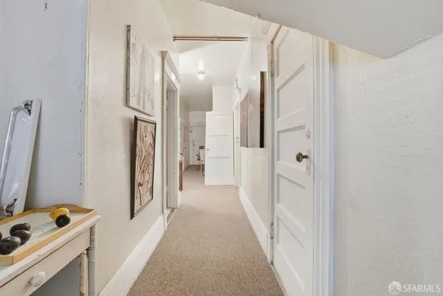 a view of a bathroom from the hallway