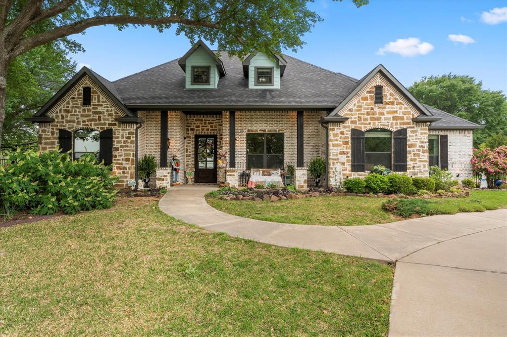 107 Nautical Point Mabank, TX 75143 - Photo 1 of 1 a front view of a house with yard and green space