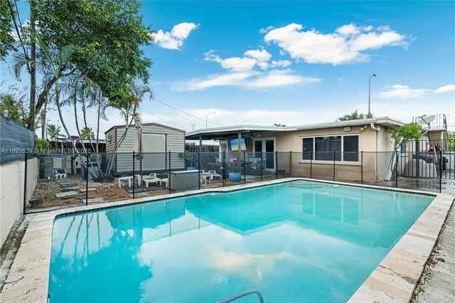 an aerial view of multiple houses with yard