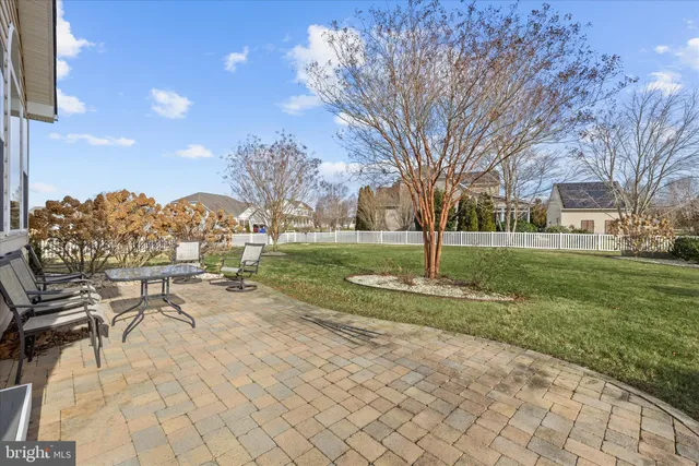 an aerial view of a house with swimming pool and garden