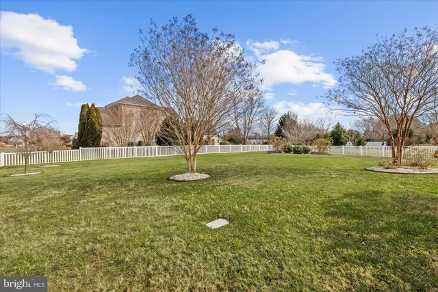 an aerial view of a house with yard swimming pool and outdoor seating