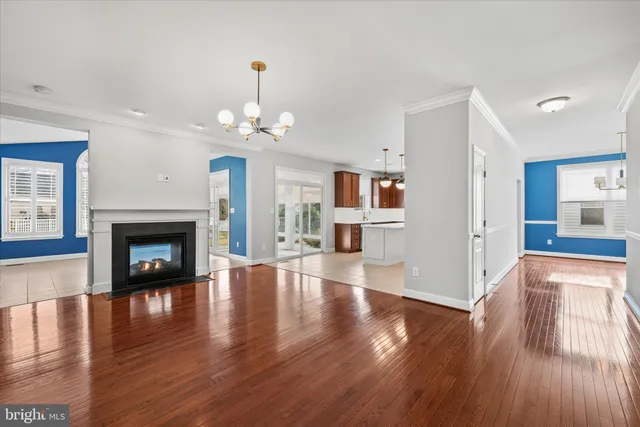a view of a livingroom with wooden floor a fireplace