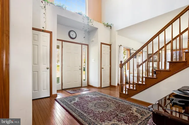 a view of an entryway with wooden floor