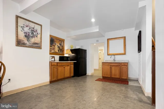 a view of a kitchen with microwave and cabinets