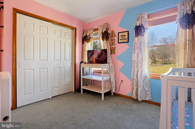 a bathroom with a shower sink and mirror