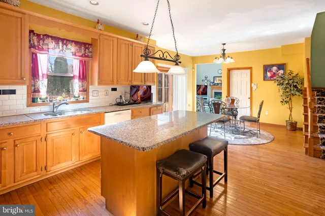 a dining table with chairs and wooden floor