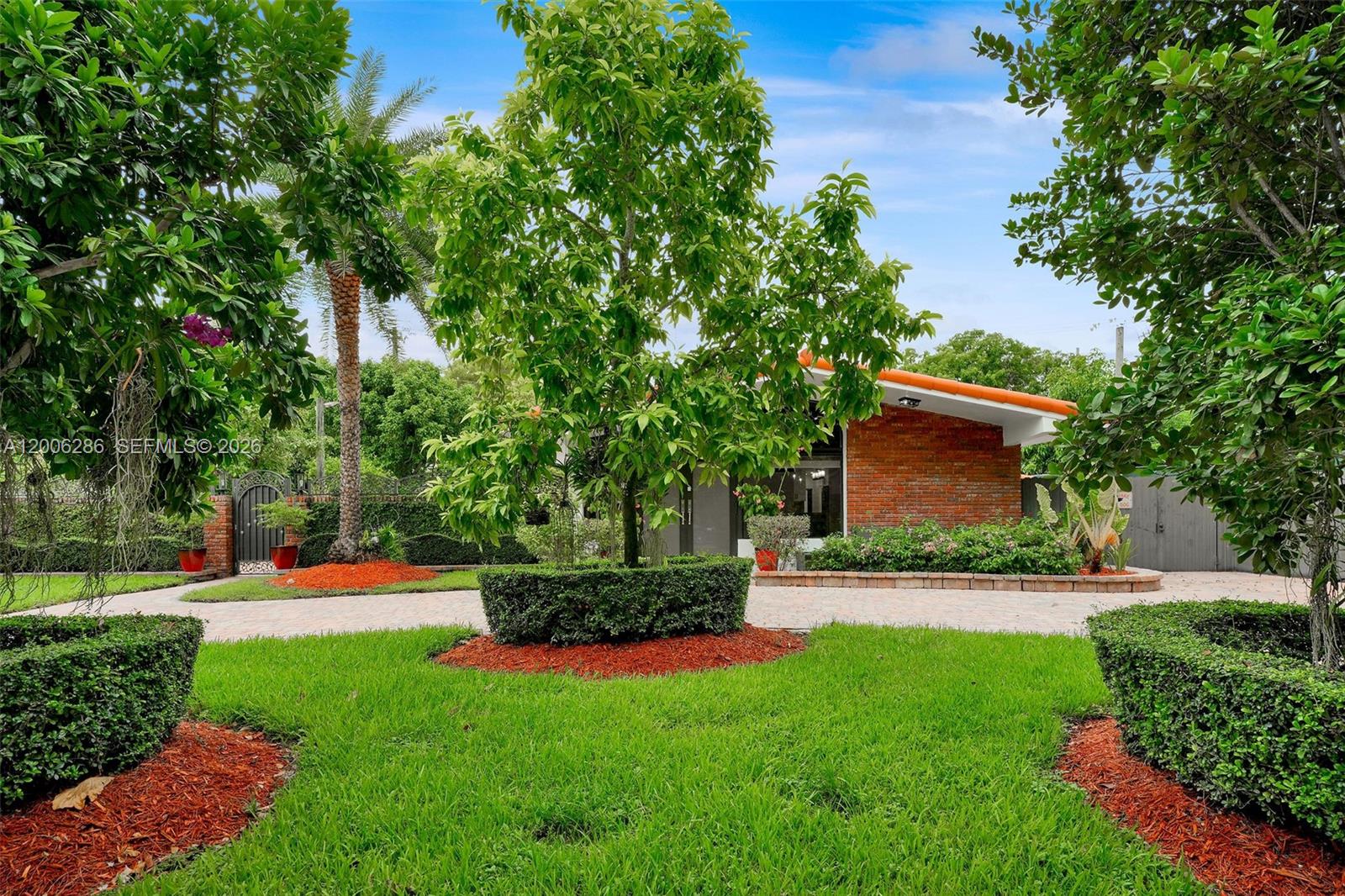 6820 Southwest 86th Avenue Miami, FL 33143 - Photo 1 of 37 a view of yard with swimming pool and green space