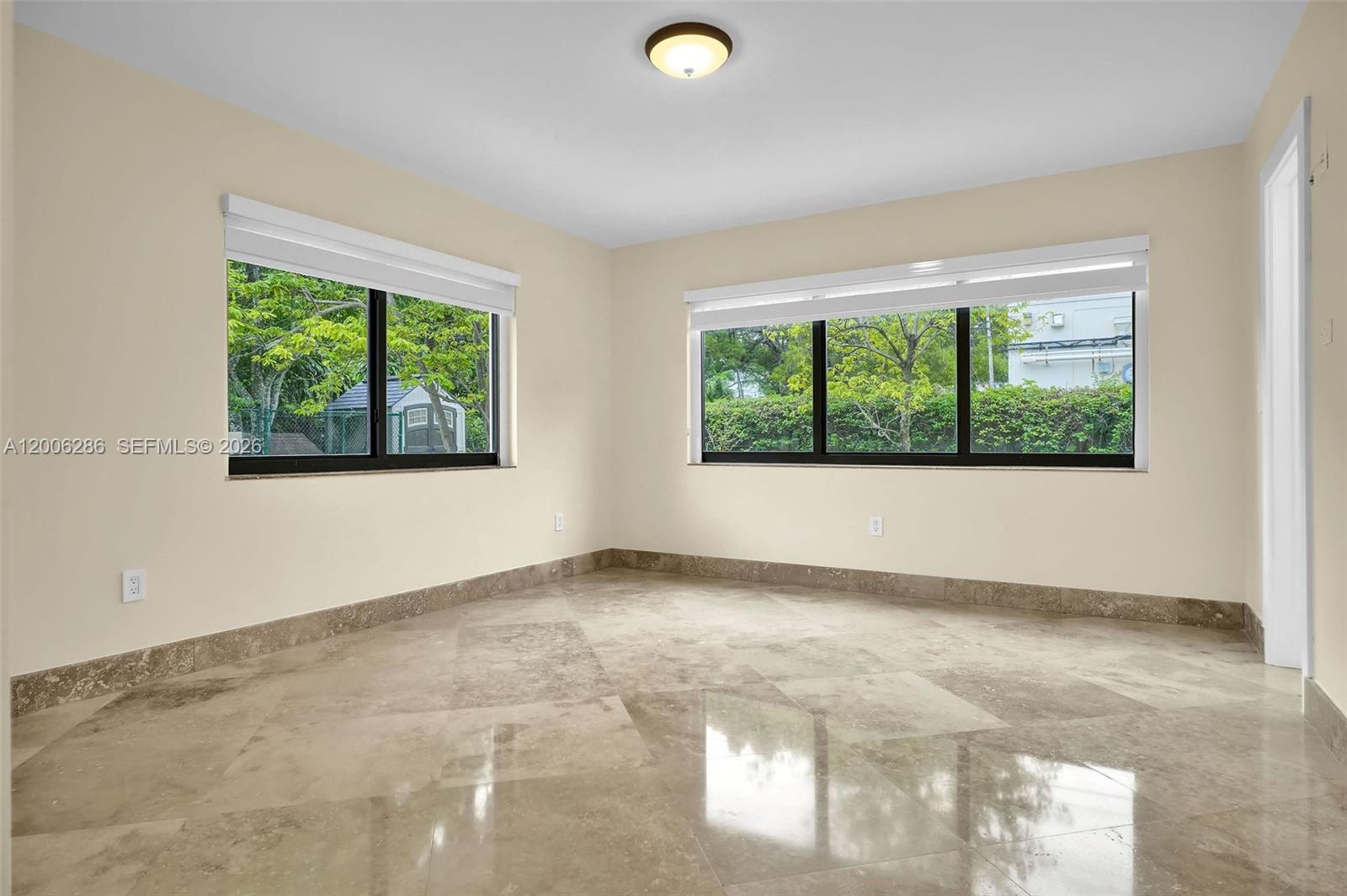 6820 Southwest 86th Avenue Miami, FL 33143 - Photo 19 of 37 an empty room with windows