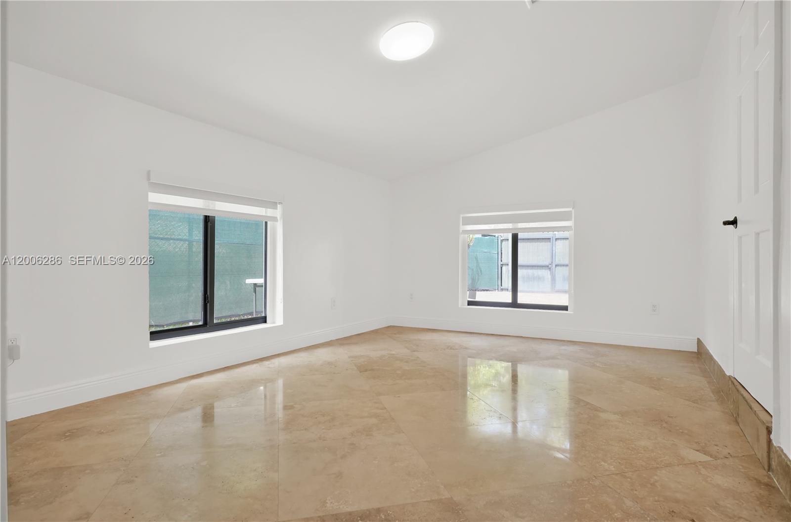 6820 Southwest 86th Avenue Miami, FL 33143 - Photo 22 of 37 an empty room with a window