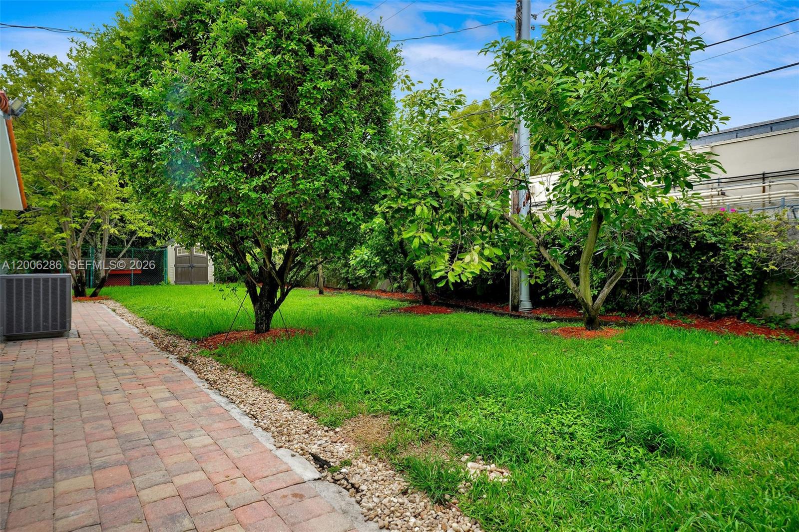 6820 Southwest 86th Avenue Miami, FL 33143 - Photo 24 of 37 a view of a garden with a fountain