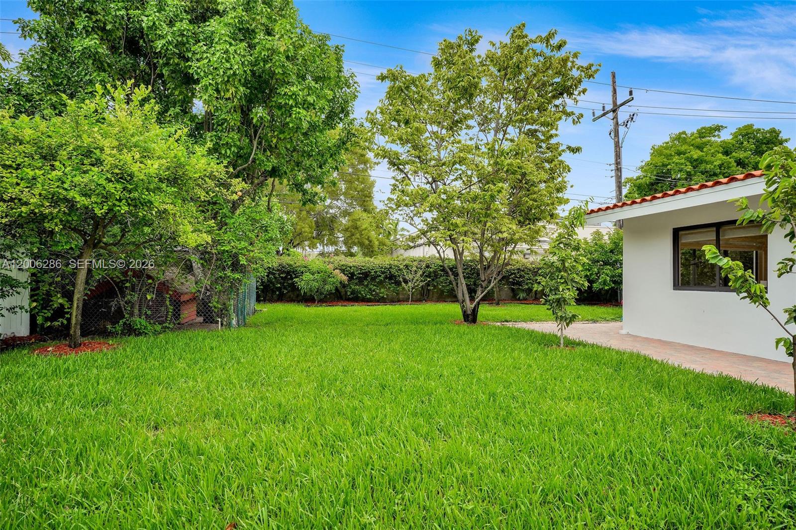 6820 Southwest 86th Avenue Miami, FL 33143 - Photo 30 of 37 a view of a tree in front of a house