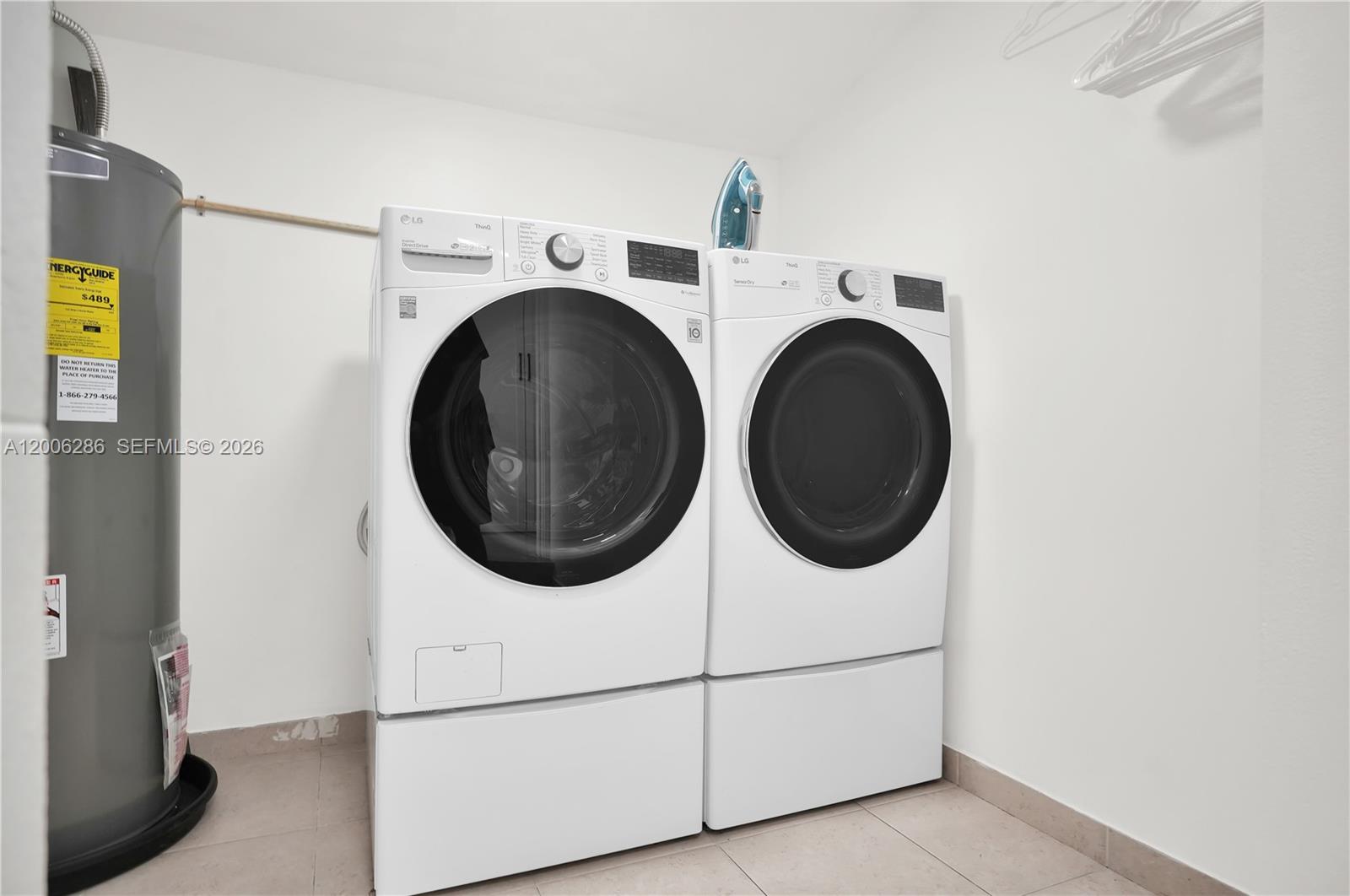 6820 Southwest 86th Avenue Miami, FL 33143 - Photo 36 of 37 a utility room with dryer and washer