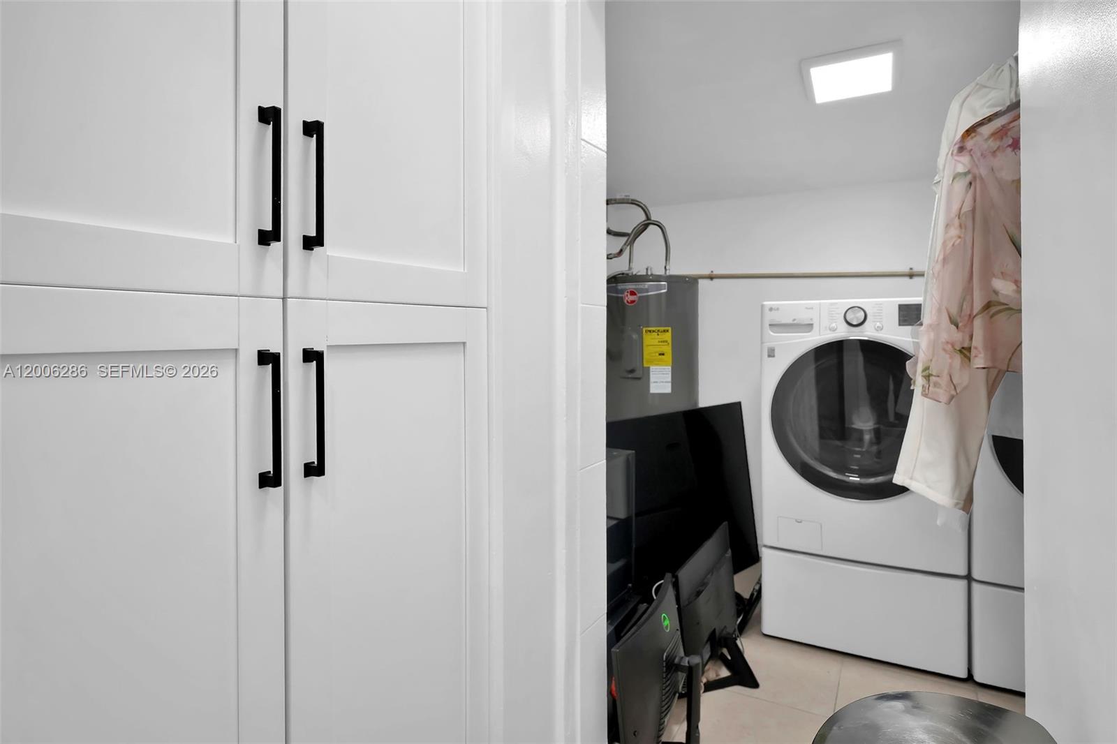 6820 Southwest 86th Avenue Miami, FL 33143 - Photo 37 of 37 a utility room with dryer and washer